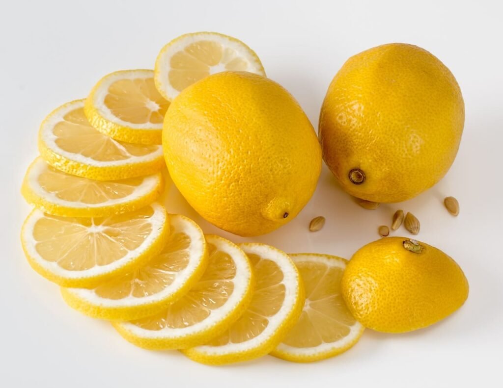 Fresh lemon slices used as a natural remedy to rinse dandruff from hair